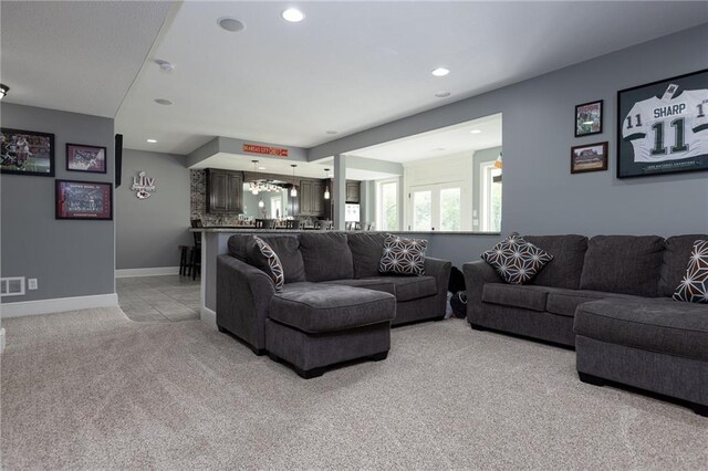 13017 Kelli Dr, Kearney, MO 64060 - living area featuring light carpet, recessed lighting, and baseboards