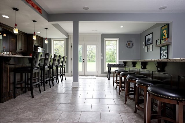 13017 Kelli Dr, Kearney, MO 64060 - dining space with a dry bar, plenty of natural light, and recessed lighting