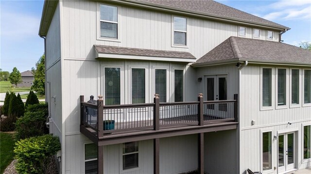 13017 Kelli Dr, Kearney, MO 64060 - back of house featuring a shingled roof, french doors, and a wooden deck