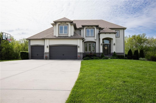 13017 Kelli Dr, Kearney, MO 64060 - french provincial home with stucco siding, an attached garage, driveway, and a front lawn