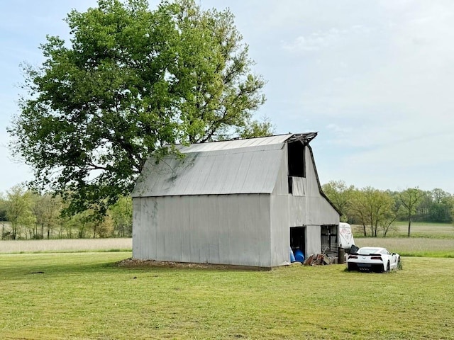 view of barn with a yard