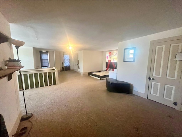rec room with carpet flooring and baseboards