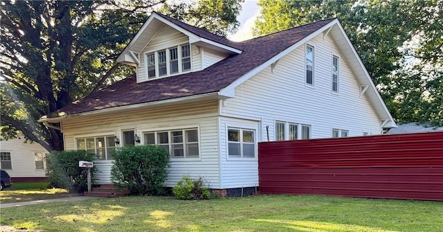 602 E 4th St, Cherryvale, KS 67335 - view of side of property featuring a lawn and roof with shingles