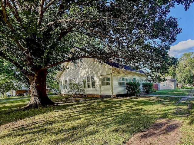602 E 4th St, Cherryvale, KS 67335 - view of side of property with a lawn and crawl space