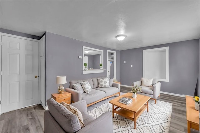 5315 Hardy Ave, Raytown, MO 64133 - living room with baseboards and wood finished floors