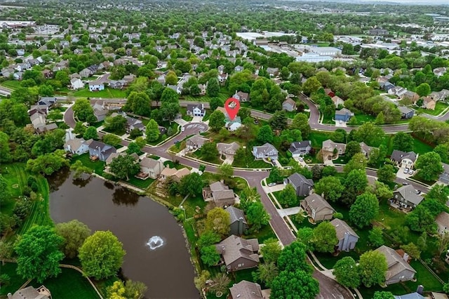 aerial view featuring a water view and a residential view