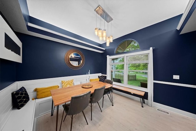 dining space featuring a chandelier, visible vents, and wood finished floors