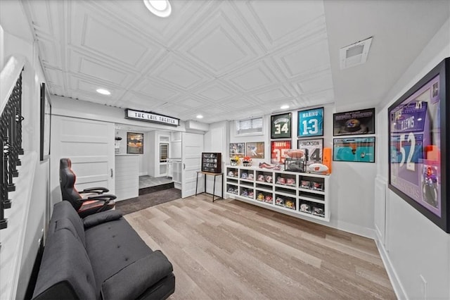 interior space featuring an ornate ceiling, recessed lighting, visible vents, and wood finished floors