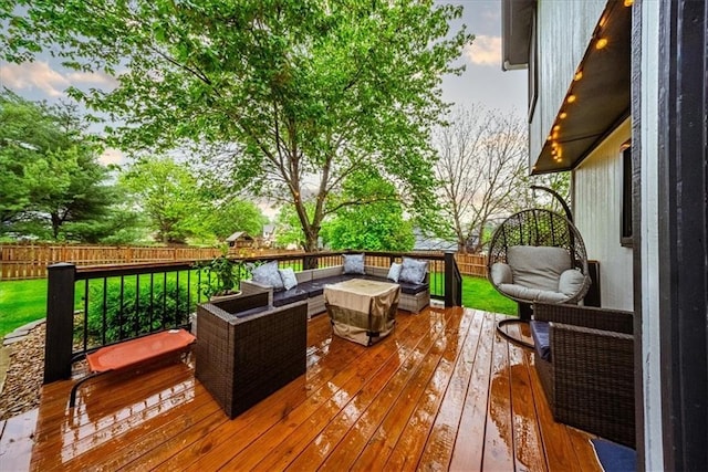 deck with a fenced backyard and outdoor lounge area