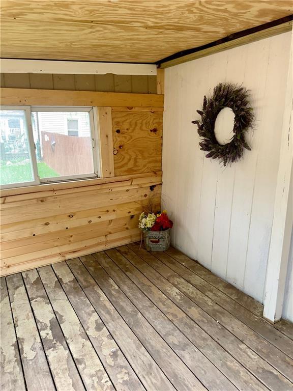 300 W Sea Ave, Independence, MO 64050 - interior space featuring wood walls, hardwood / wood-style flooring, and wooden ceiling