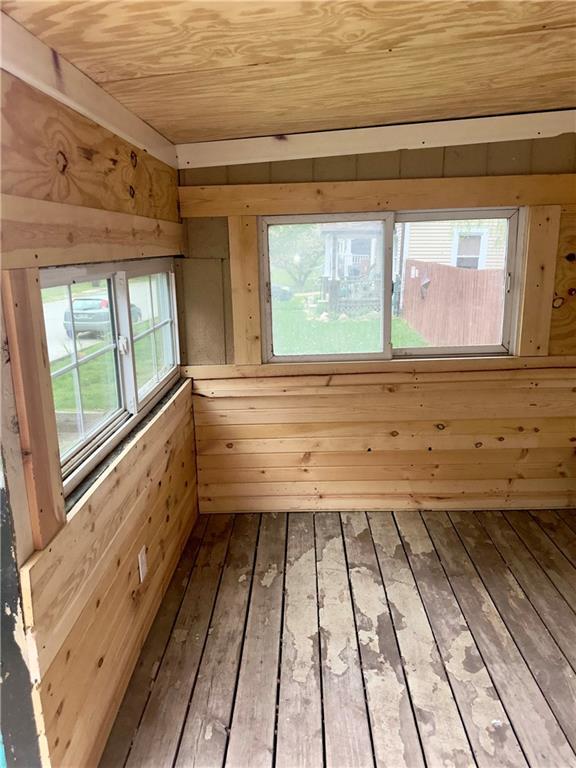 300 W Sea Ave, Independence, MO 64050 - interior space with wood ceiling, wooden walls, and wood-type flooring