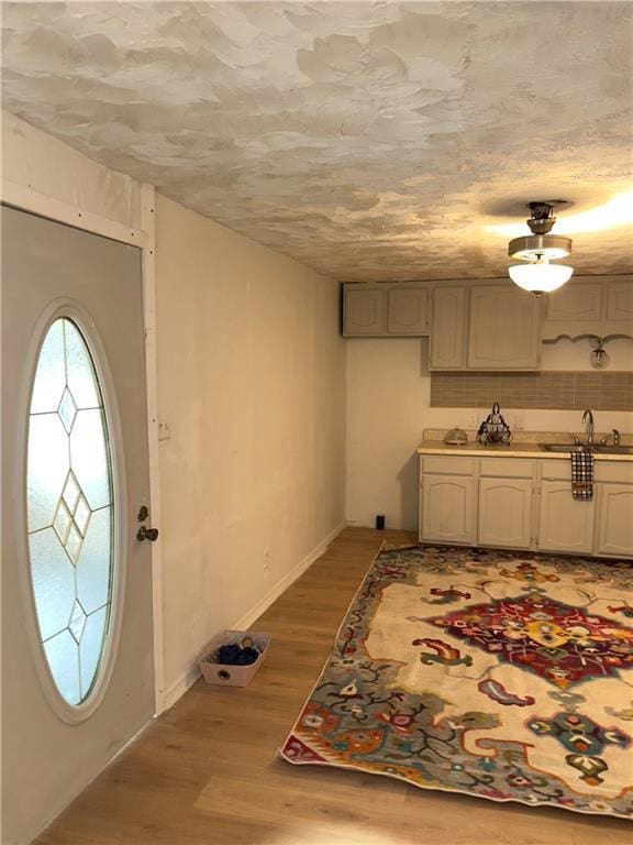 300 W Sea Ave, Independence, MO 64050 - entryway featuring baseboards and light wood-style floors