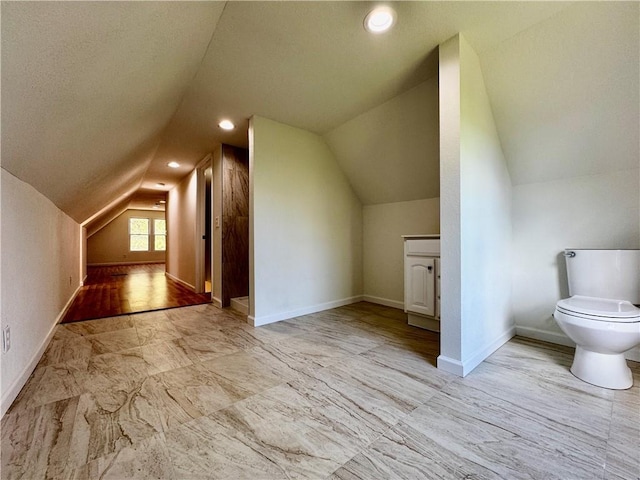 1502 6th Ave, Saint Joseph, MO 64505 - bonus room with baseboards, marble finish floor, and vaulted ceiling