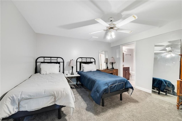 carpeted bedroom featuring ensuite bathroom and ceiling fan