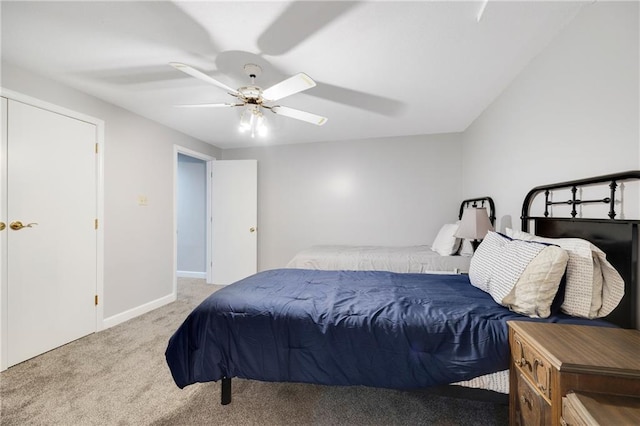 bedroom featuring a ceiling fan, baseboards, and carpet