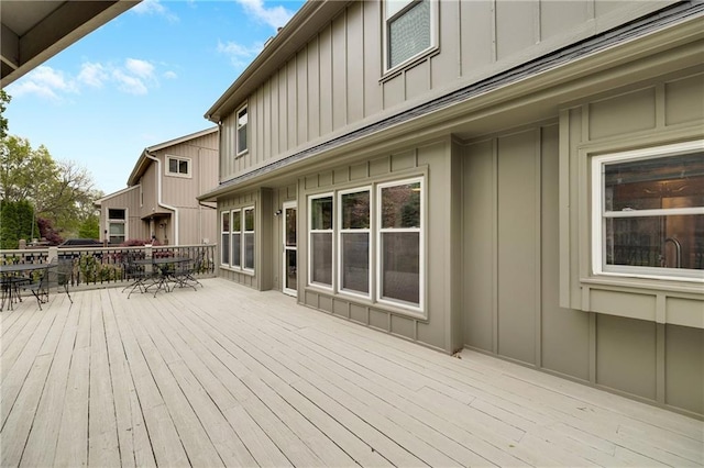 wooden terrace featuring outdoor dining space