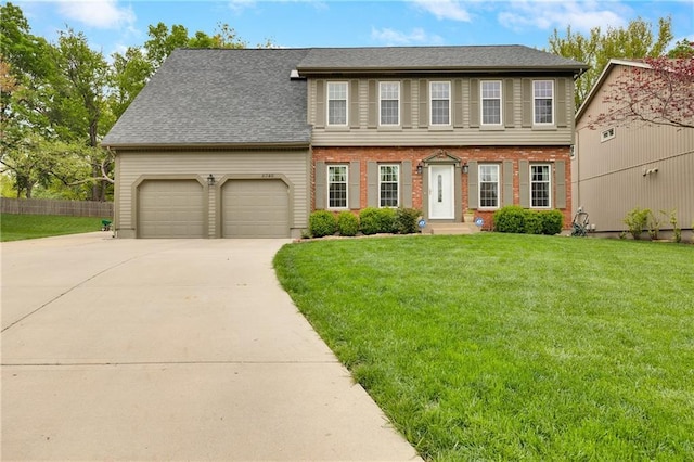 8346 Oakview Cir, Lenexa, KS 66215 - view of front facade with an attached garage, concrete driveway, roof with shingles, and brick siding
