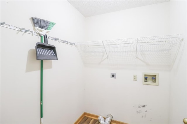 laundry area with electric dryer hookup, hookup for a washing machine, and laundry area