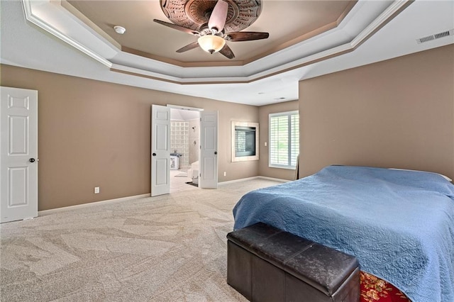 6715 NW 102nd Ter, Kansas City, MO 64154 - carpeted bedroom with a tray ceiling, baseboards, ensuite bathroom, and ceiling fan