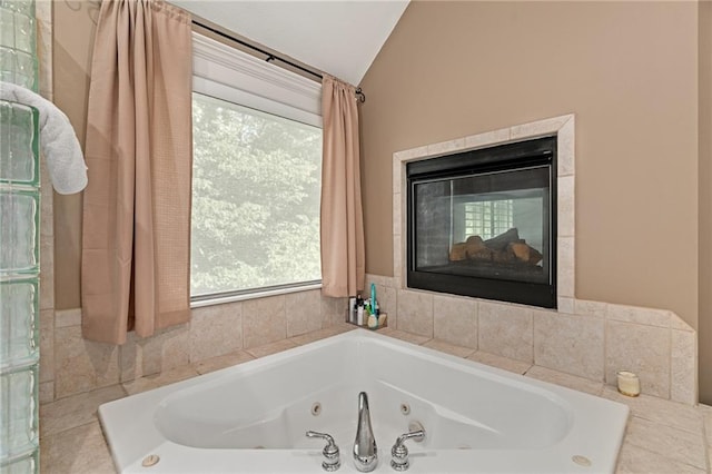 6715 NW 102nd Ter, Kansas City, MO 64154 - full bath featuring lofted ceiling, plenty of natural light, a jetted tub, and a fireplace