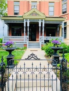 exterior space with fence, a gate, and a porch