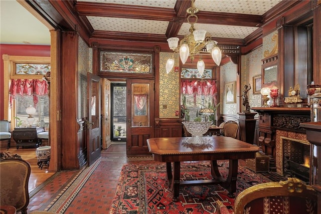 interior space featuring crown molding, beam ceiling, brick floor, a chandelier, and coffered ceiling