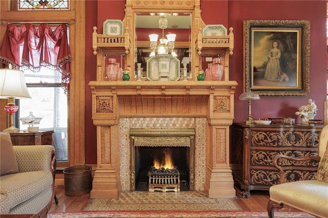 living area with wood finished floors and a fireplace