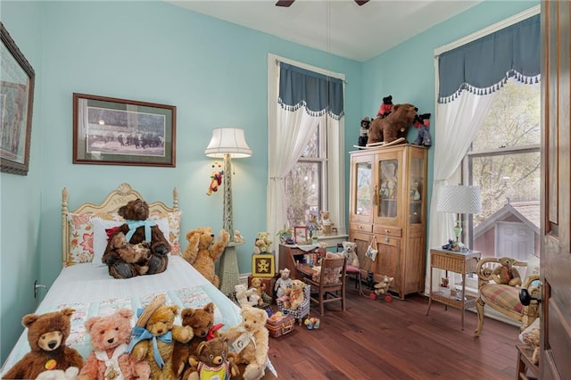 bedroom with wood-type flooring and a ceiling fan