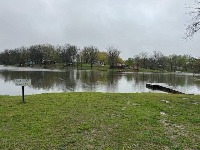 property view of water with a dock
