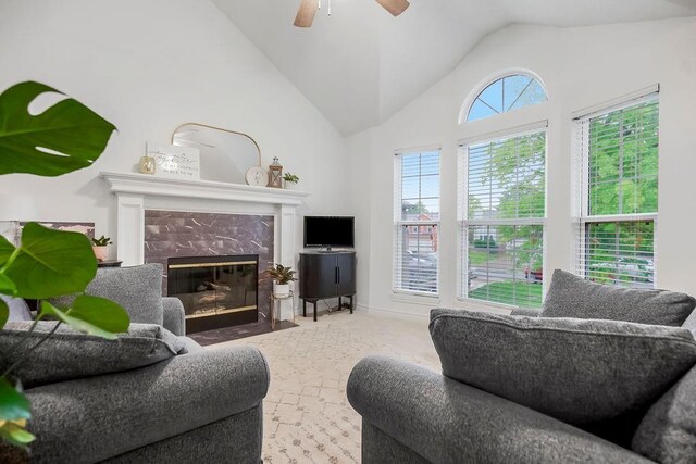 17525 W 111th Ct, Olathe, KS 66061 - living area with lofted ceiling, a high end fireplace, ceiling fan, and carpet floors