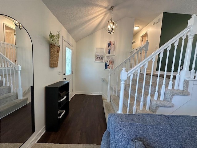 17525 W 111th Ct, Olathe, KS 66061 - entryway with stairway, lofted ceiling, baseboards, and a textured ceiling