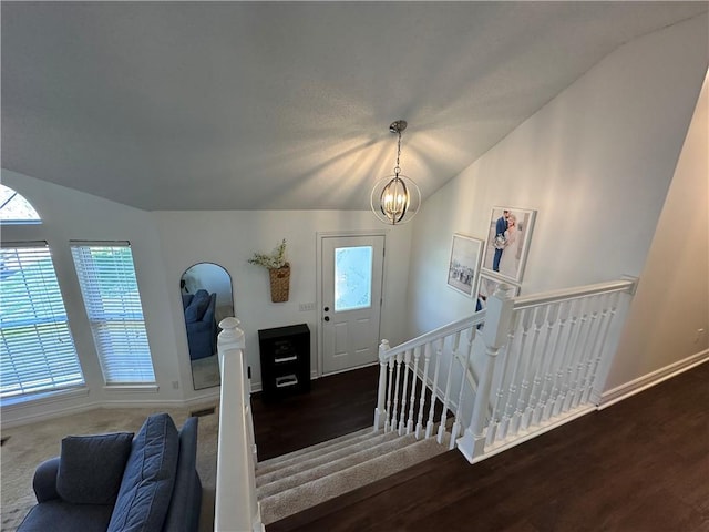17525 W 111th Ct, Olathe, KS 66061 - foyer featuring lofted ceiling, a chandelier, healthy amount of natural light, wood finished floors, and baseboards