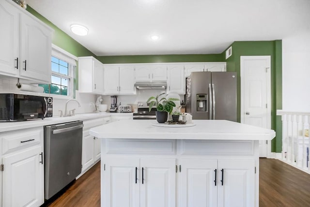 17525 W 111th Ct, Olathe, KS 66061 - kitchen featuring appliances with stainless steel finishes, under cabinet range hood, white cabinets, and recessed lighting