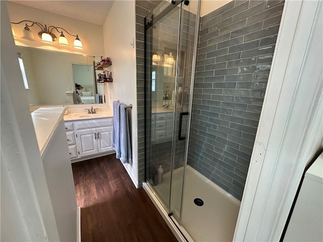 17525 W 111th Ct, Olathe, KS 66061 - full bath with wood finished floors, vanity, and a shower stall