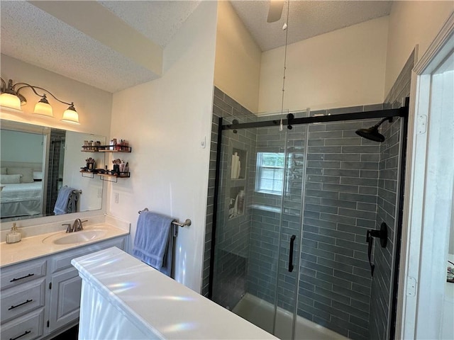 17525 W 111th Ct, Olathe, KS 66061 - ensuite bathroom featuring a stall shower, a textured ceiling, and vanity