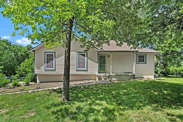 5120 Hardy St, Mission, KS 66202 - rear view of house featuring a lawn