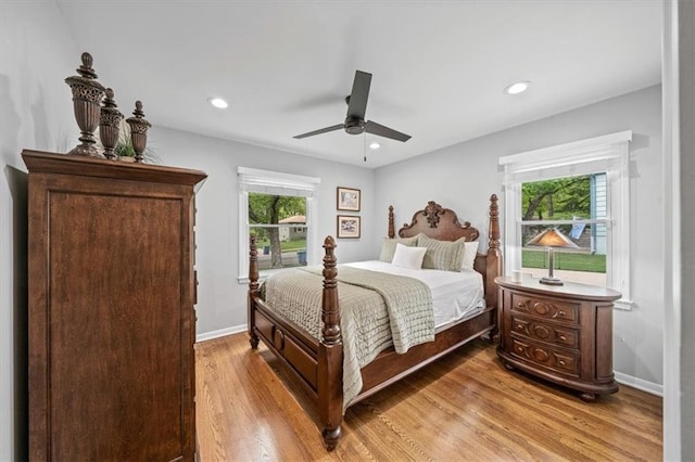 bedroom with light wood-style floors, recessed lighting, baseboards, and a ceiling fan
