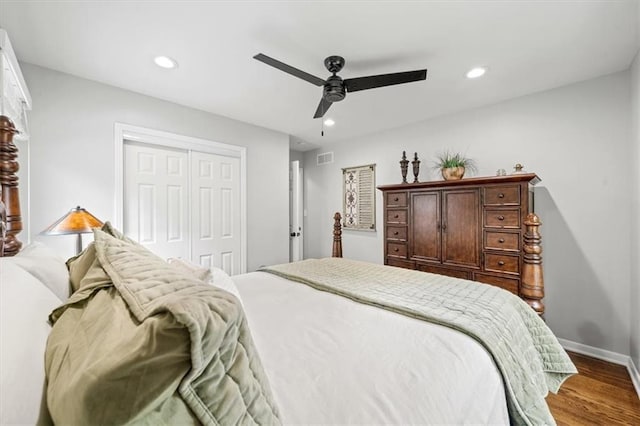 bedroom featuring ceiling fan, wood finished floors, baseboards, a closet, and recessed lighting