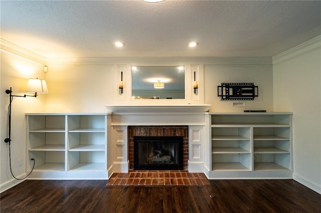 unfurnished living room with a textured ceiling, wood finished floors, crown molding, and baseboards