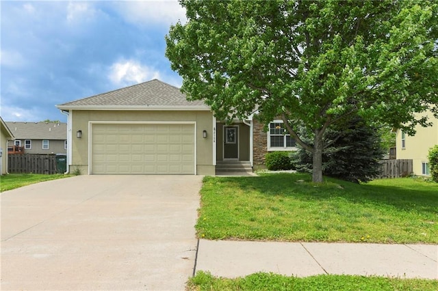 2136 Alder St, Leavenworth, KS 66048 - view of front of home with fence, an attached garage, driveway, and a front yard