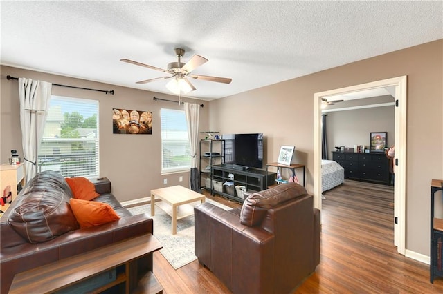 2136 Alder St, Leavenworth, KS 66048 - living room with baseboards, a ceiling fan, and wood finished floors