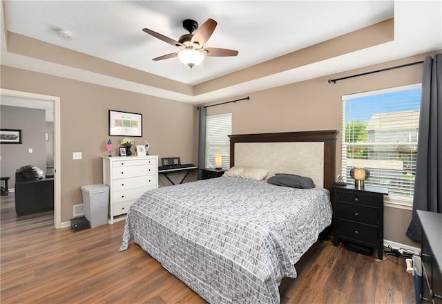 2136 Alder St, Leavenworth, KS 66048 - bedroom featuring a raised ceiling, baseboards, and dark wood-style floors