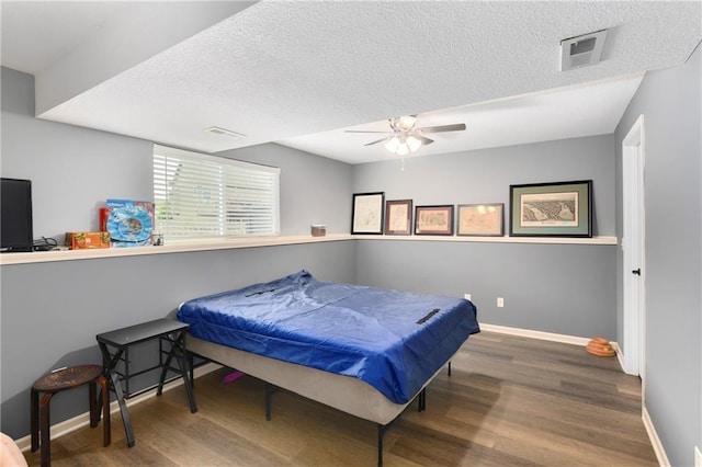2136 Alder St, Leavenworth, KS 66048 - bedroom with visible vents, baseboards, a textured ceiling, and wood finished floors