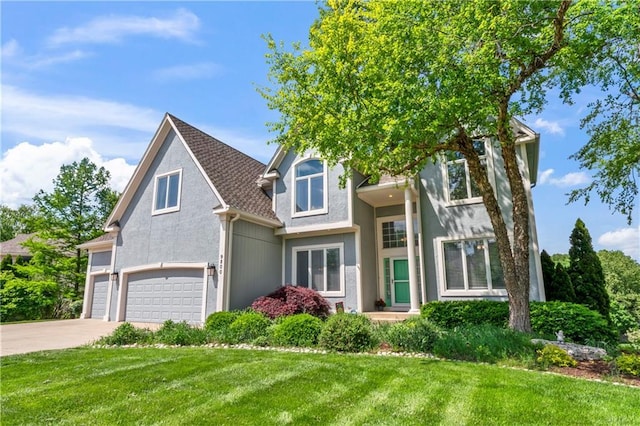 9800 W 147th St, Overland Park, KS 66221 - view of front of home with stucco siding, a front lawn, driveway, and a garage