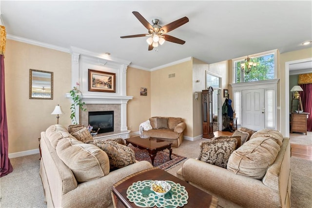 9800 W 147th St, Overland Park, KS 66221 - living room featuring ceiling fan, light carpet, a tiled fireplace, and crown molding