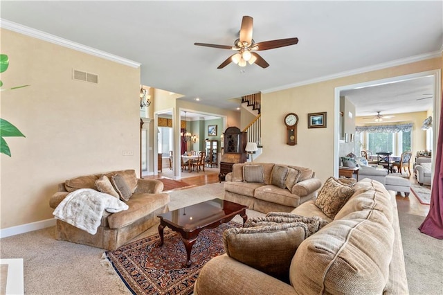 9800 W 147th St, Overland Park, KS 66221 - carpeted living room featuring a ceiling fan, stairs, and ornamental molding