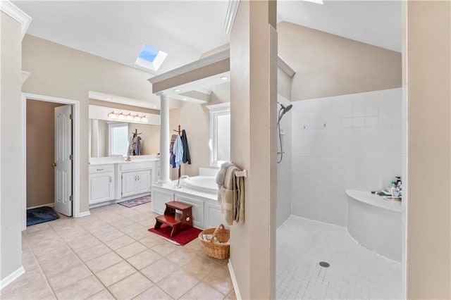 9800 W 147th St, Overland Park, KS 66221 - full bathroom featuring a skylight, tile patterned flooring, a tile shower, vanity, and a bath