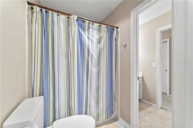 9800 W 147th St, Overland Park, KS 66221 - bathroom featuring toilet and curtained shower