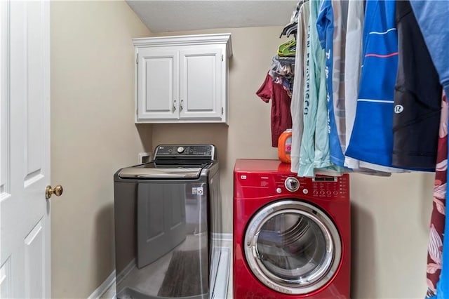 9800 W 147th St, Overland Park, KS 66221 - laundry room featuring independent washer and dryer, cabinet space, and a textured ceiling