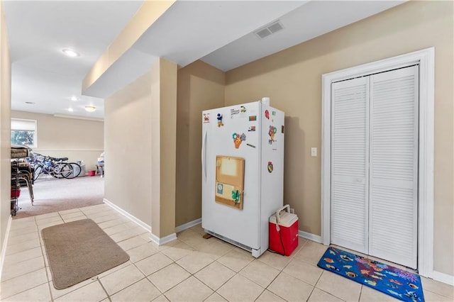 9800 W 147th St, Overland Park, KS 66221 - kitchen with freestanding refrigerator, light tile patterned floors, and recessed lighting